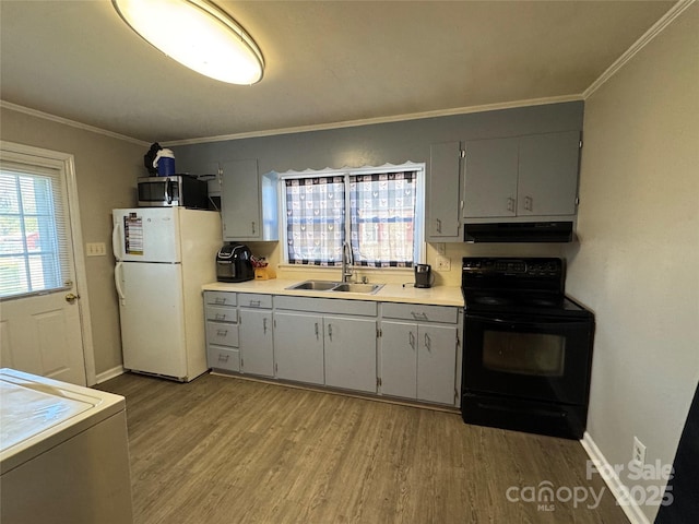 kitchen featuring white refrigerator, sink, ornamental molding, light wood-type flooring, and black / electric stove