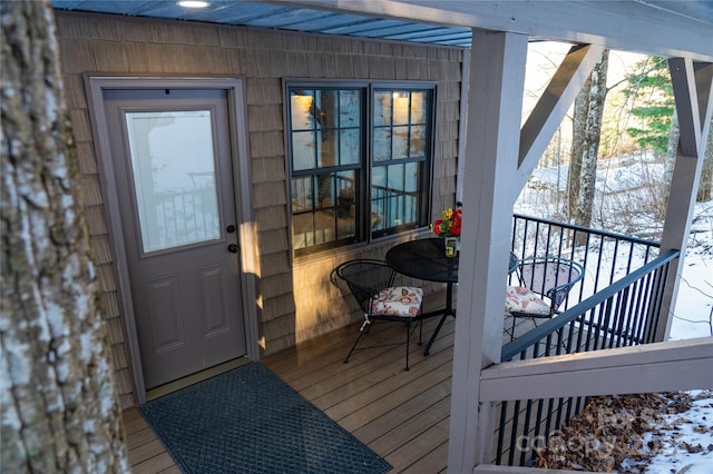 view of snow covered property entrance