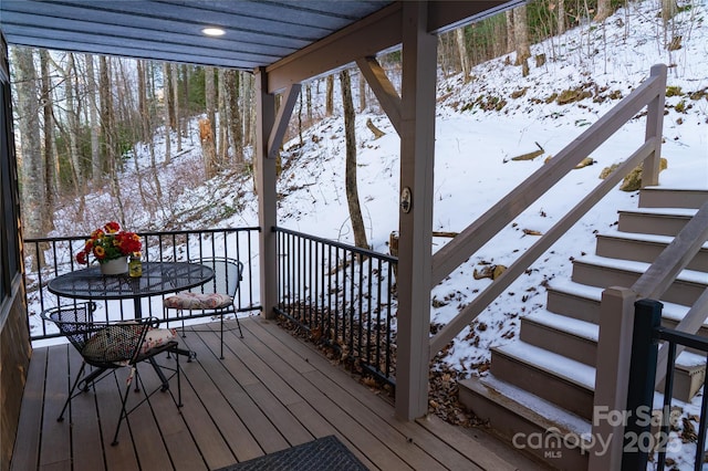 view of snow covered deck