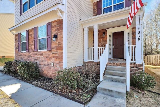 entrance to property with a porch