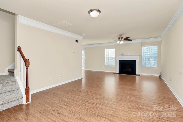 unfurnished living room featuring ceiling fan, light hardwood / wood-style floors, and crown molding