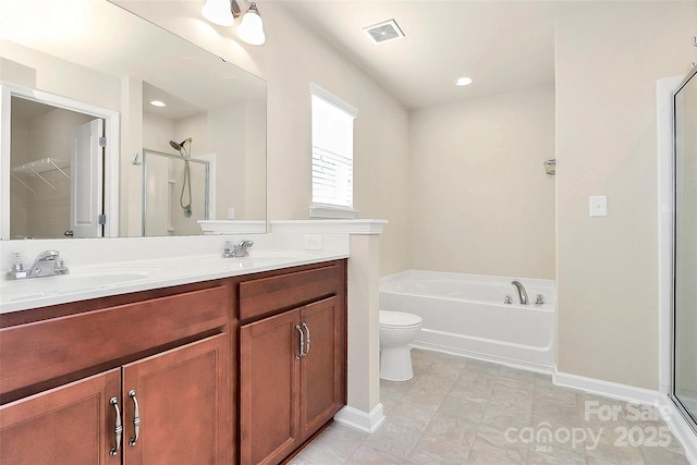 full bathroom with tile patterned flooring, vanity, independent shower and bath, and toilet