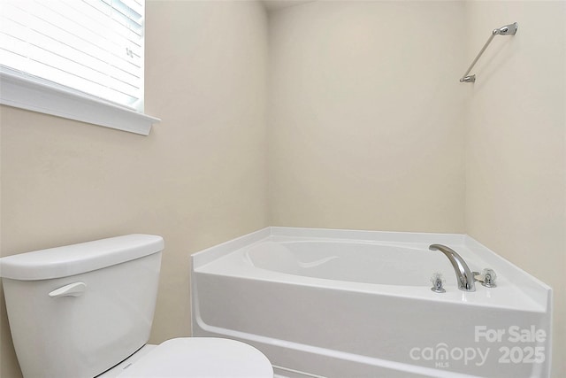 bathroom with a bathtub and toilet