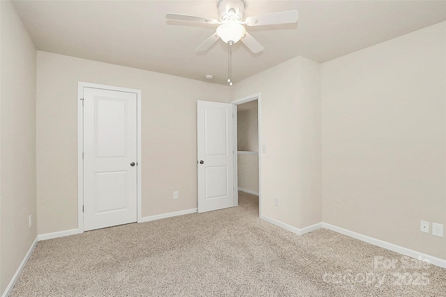 unfurnished bedroom with carpet flooring, ceiling fan, and a closet