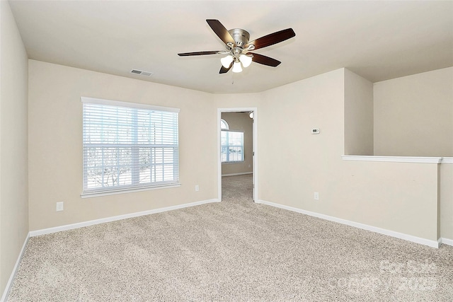 unfurnished room with carpet flooring and ceiling fan