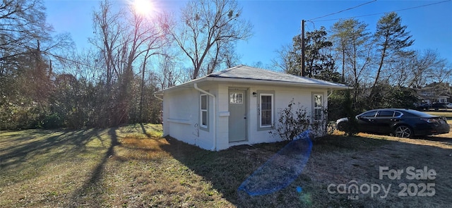 view of property exterior with a yard