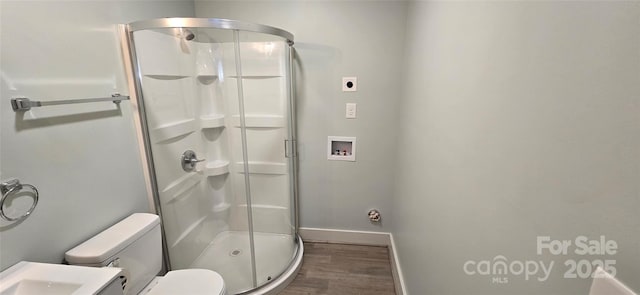 bathroom featuring hardwood / wood-style floors, vanity, toilet, and an enclosed shower