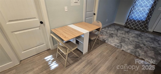 dining room with wood-type flooring