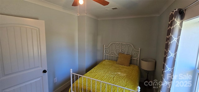 bedroom featuring ceiling fan and crown molding