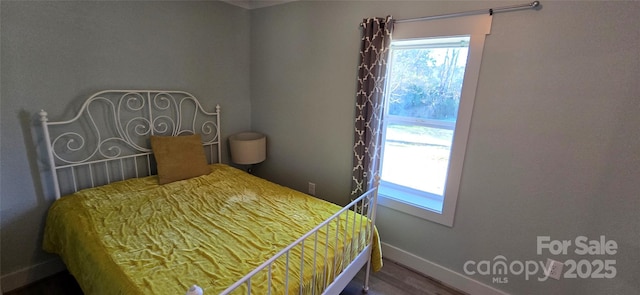 bedroom featuring hardwood / wood-style flooring