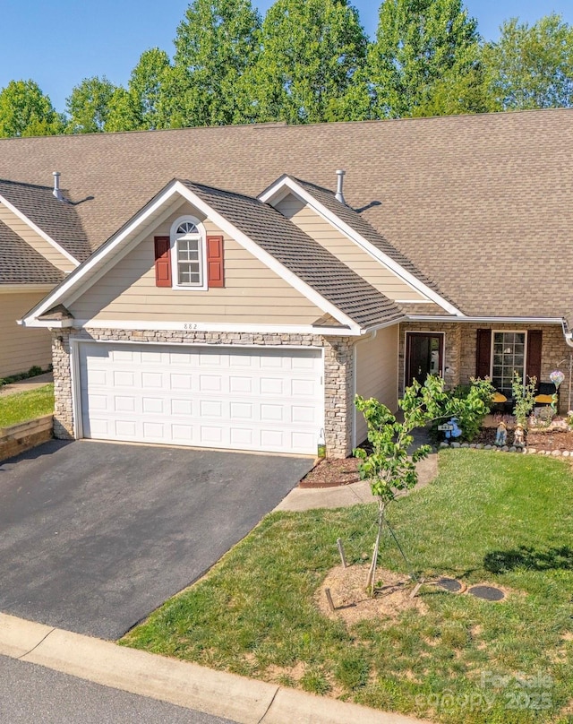 view of front facade with a front lawn and a garage