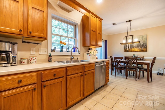 kitchen with stainless steel dishwasher, ornamental molding, sink, an inviting chandelier, and hanging light fixtures