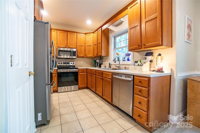 kitchen with light tile patterned flooring, sink, and stainless steel appliances