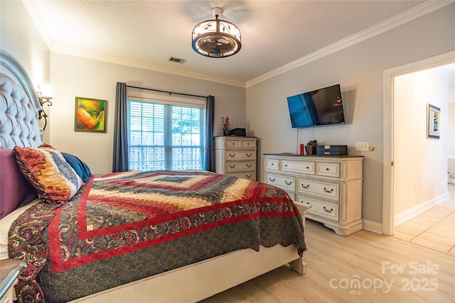 bedroom with a textured ceiling, crown molding, and light hardwood / wood-style flooring