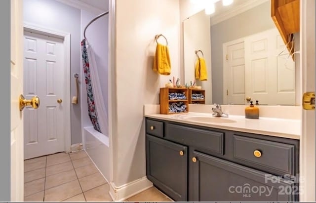 bathroom featuring tile patterned flooring, vanity, ornamental molding, and shower / bathtub combination with curtain