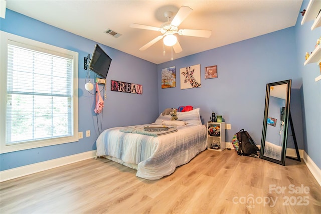 bedroom featuring light hardwood / wood-style flooring and ceiling fan