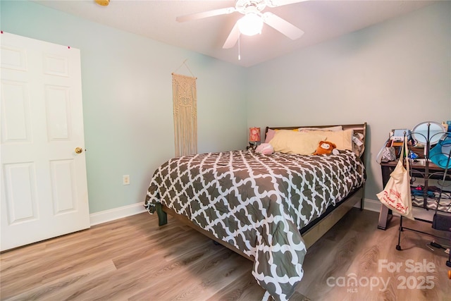 bedroom featuring hardwood / wood-style flooring and ceiling fan