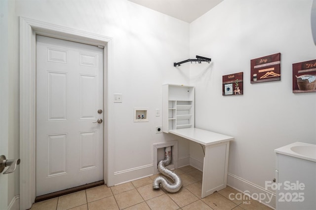 laundry area with hookup for a washing machine, light tile patterned floors, and hookup for an electric dryer