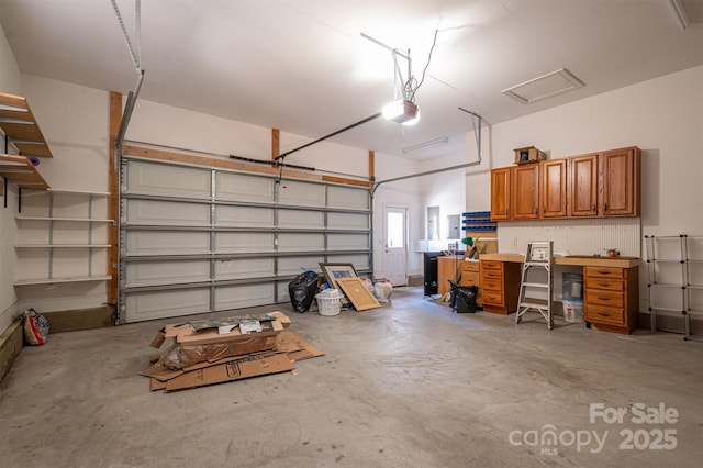 garage featuring a garage door opener