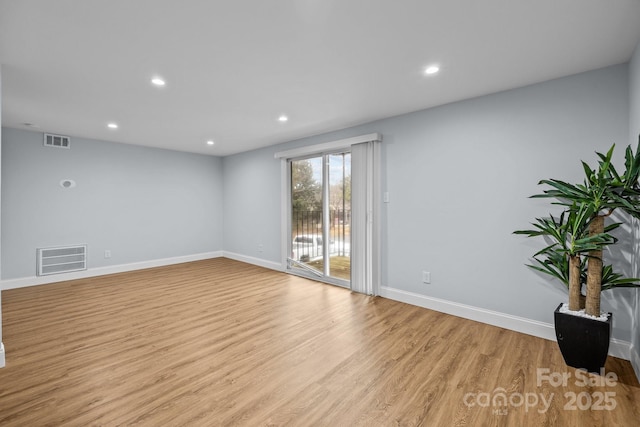 unfurnished room featuring light hardwood / wood-style flooring