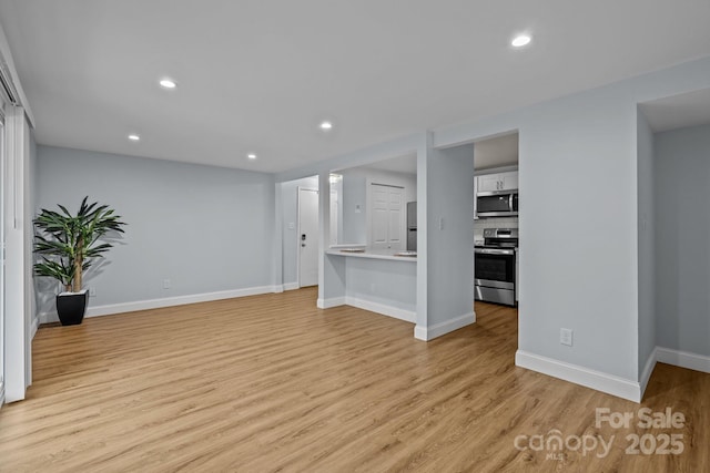 unfurnished living room with light hardwood / wood-style floors