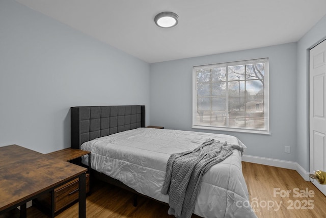 bedroom featuring hardwood / wood-style flooring