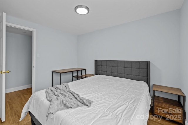 bedroom featuring wood-type flooring