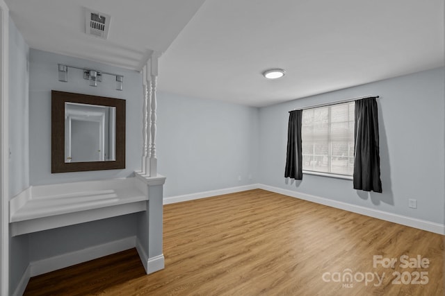 spare room featuring hardwood / wood-style floors