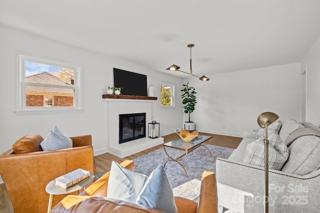 living room featuring a fireplace and light hardwood / wood-style flooring