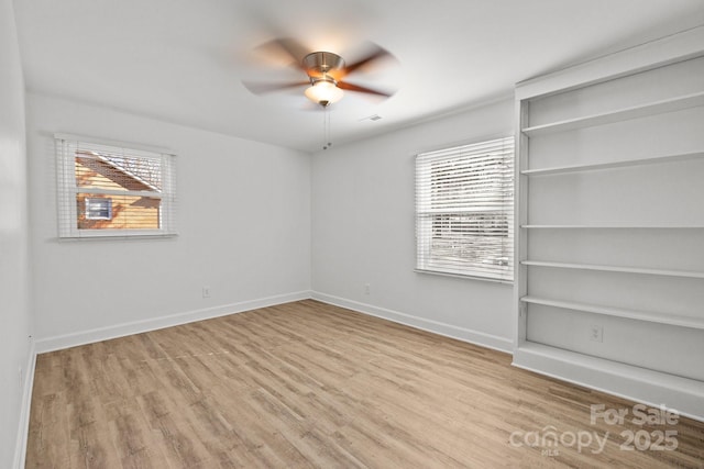 spare room with ceiling fan and light hardwood / wood-style flooring