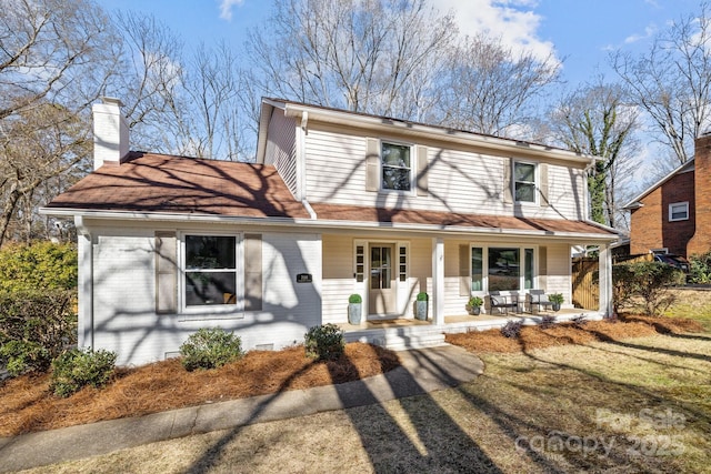 view of property featuring covered porch