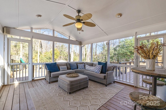 sunroom / solarium featuring ceiling fan