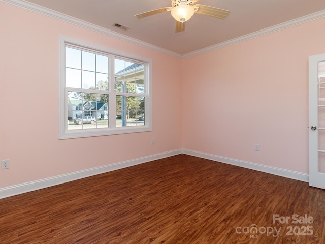 empty room featuring dark hardwood / wood-style floors, ceiling fan, and ornamental molding