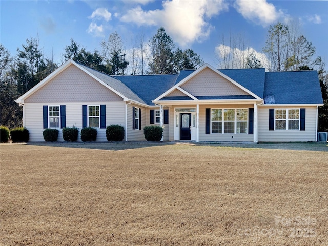 ranch-style home featuring a front lawn