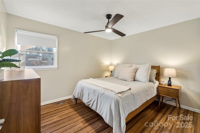 bedroom featuring ceiling fan and dark hardwood / wood-style floors