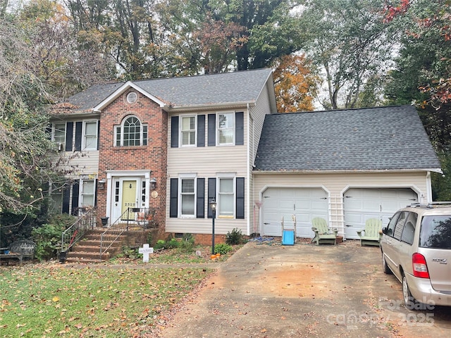 colonial inspired home featuring a garage