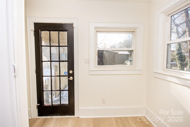 doorway with light hardwood / wood-style floors