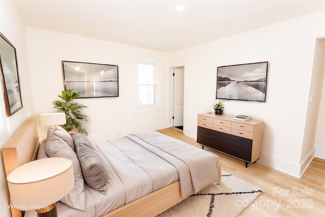 bedroom featuring light hardwood / wood-style floors