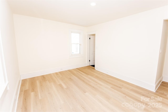 spare room featuring light hardwood / wood-style flooring