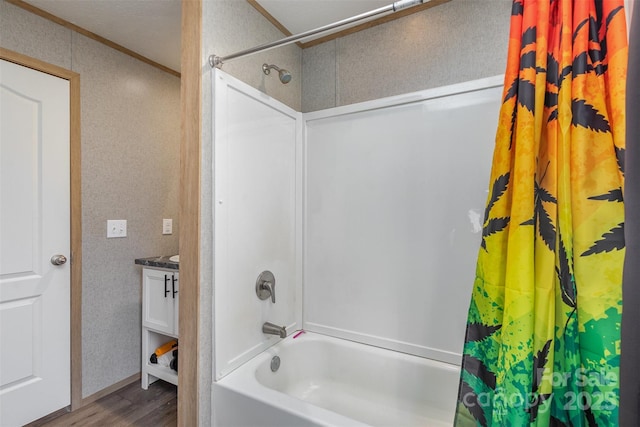 bathroom featuring hardwood / wood-style flooring, a textured ceiling, vanity, and shower / bath combination with curtain