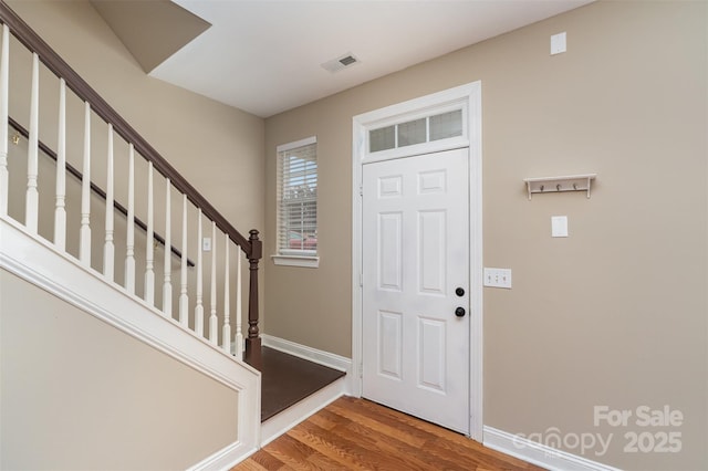 foyer with wood-type flooring