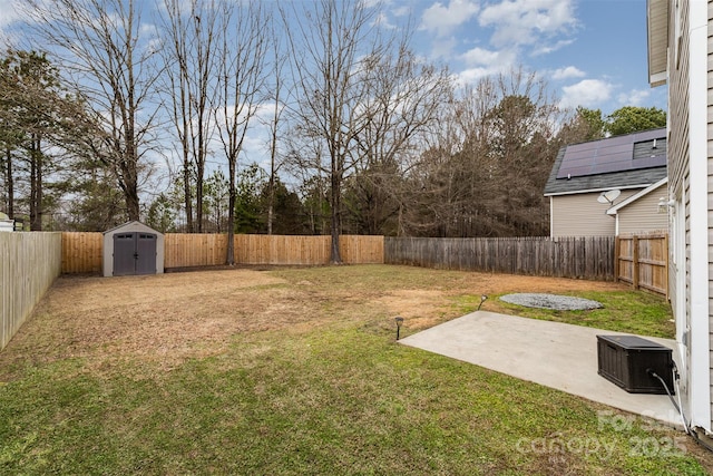 view of yard with a patio and a shed