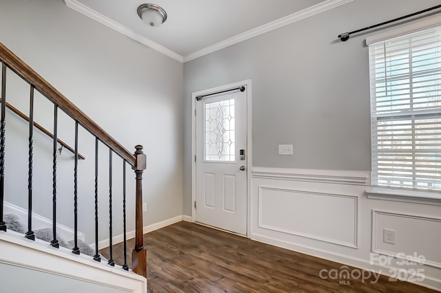 foyer featuring plenty of natural light, dark hardwood / wood-style floors, and crown molding