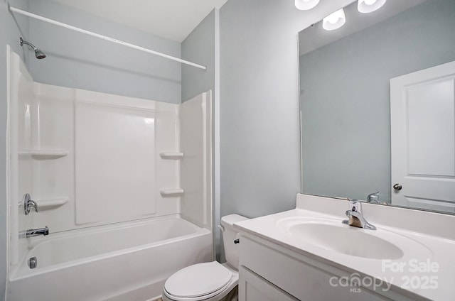 full bathroom featuring bathtub / shower combination, vanity, and toilet