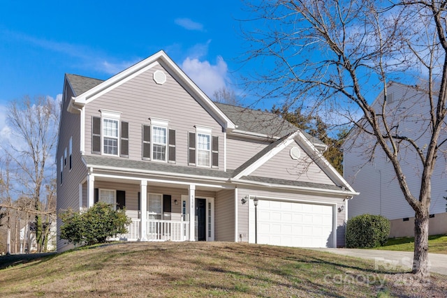 front of property with covered porch, a garage, and a front yard