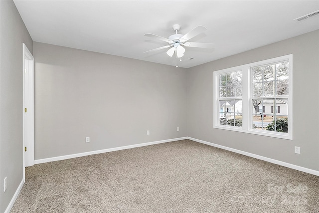 spare room with ceiling fan and carpet flooring