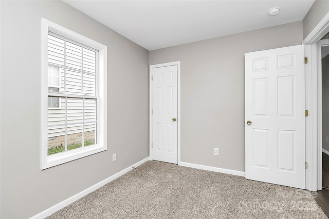 unfurnished bedroom featuring carpet