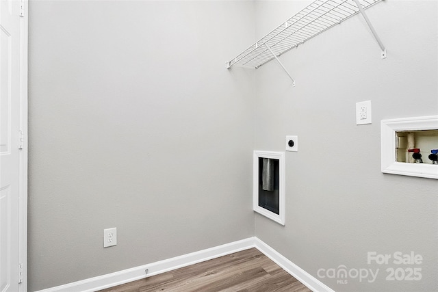 laundry area featuring hardwood / wood-style floors, electric dryer hookup, and washer hookup