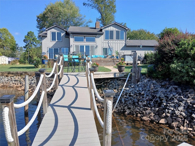 dock area with a deck with water view