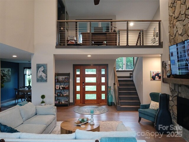 living room featuring hardwood / wood-style floors and a high ceiling